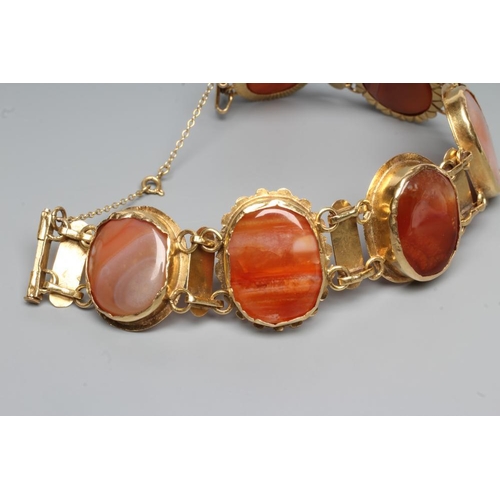 197 - A BRACELET, the six oval polished banded agate panels in rub-over settings with bar links between, u... 