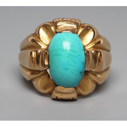 199 - A GENTLEMAN'S RING, the oval cabochon polished turquoise set to an open fancy surround and wide shan... 