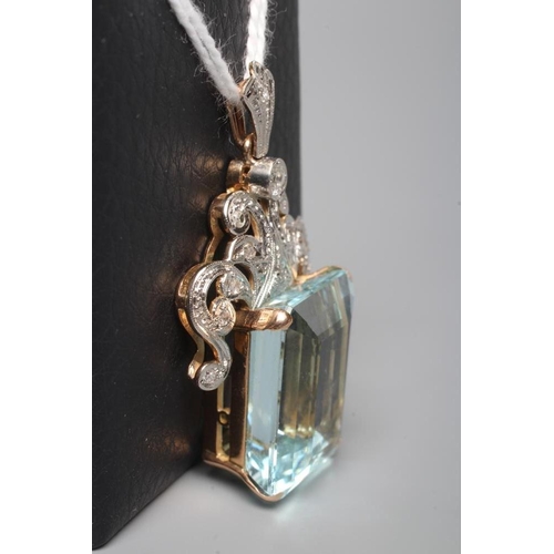 215 - AN AQUAMARINE AND DIAMOND PENDANT, the oblong facet cut aquamarine claw set to an unmarked yellow me... 