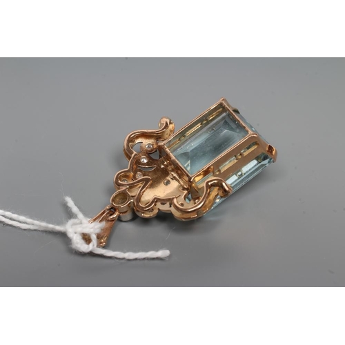 215 - AN AQUAMARINE AND DIAMOND PENDANT, the oblong facet cut aquamarine claw set to an unmarked yellow me... 