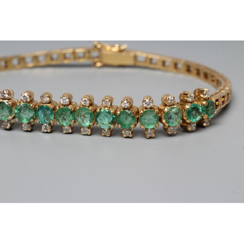 218 - AN EMERALD AND DIAMOND BRACELET, the sixteen circular facet cut emeralds each flanked by two small r... 