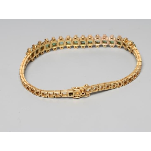 218 - AN EMERALD AND DIAMOND BRACELET, the sixteen circular facet cut emeralds each flanked by two small r... 