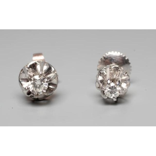 223 - A PAIR OF SOLITAIRE DIAMOND EAR STUDS, the round brilliant cut stones each of approximately 0.050cts... 