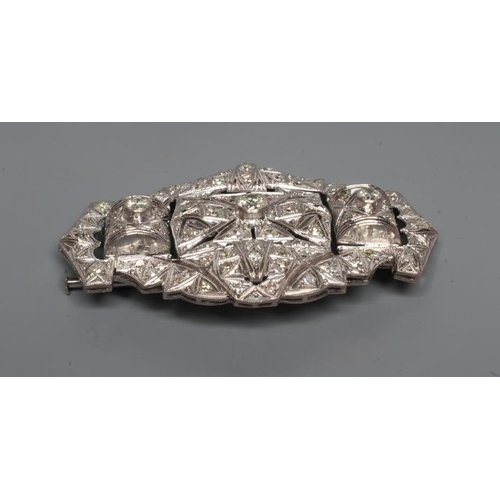 235 - A DIAMOND OVAL OPEN PANEL BROOCH, the central open back collet set stone of approximately 0.35cts fl... 