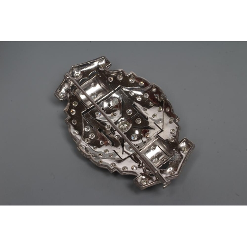 235 - A DIAMOND OVAL OPEN PANEL BROOCH, the central open back collet set stone of approximately 0.35cts fl... 