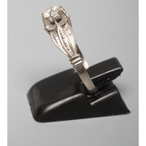 239 - A SOLITAIRE DIAMOND RING, the brilliant cut stone of approximately 0.5cts claw set to a flower panel... 