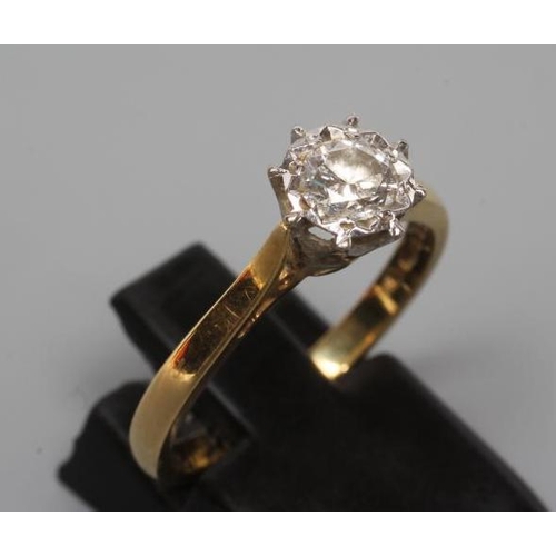 242 - A SOLITAIRE DIAMOND RING, the round brilliant cut stone of 0.31cts illusion set to a plain 18ct gold... 