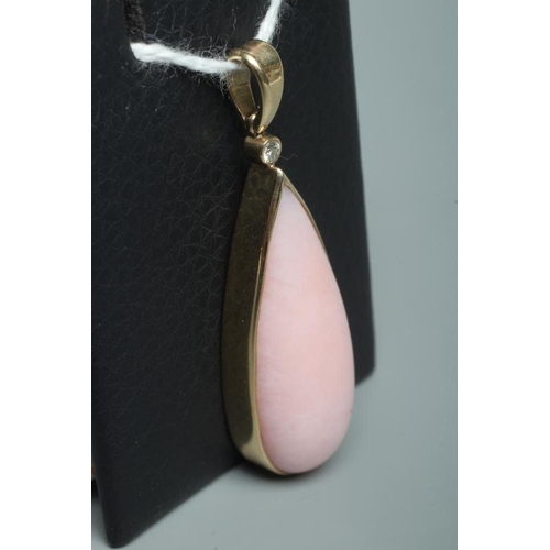 254 - A PINK CHALCEDONY PENDANT, the shaped polished stone collet set in 9ct gold with a diamond point bel... 