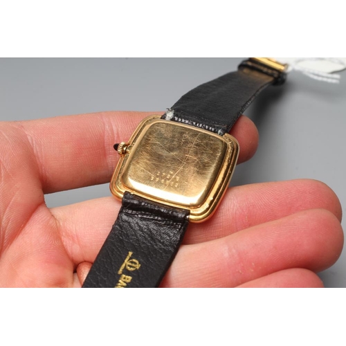 168 - A GENTLEMAN'S BAUME & MERCIER 18CT GOLD WRISTWATCH, the plain rounded square brushed gilt dial in a ... 