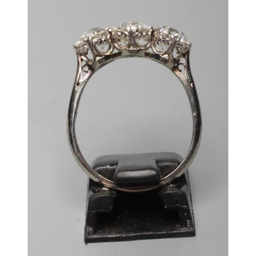 178 - A THREE STONE DIAMOND RING, the brilliant cut stones totalling approximately 2.75cts, claw set to a ... 