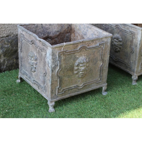 458 - A PAIR OF LEAD PLANTERS, 20th century, of square form, the panelled sides with lion masks, raised on... 