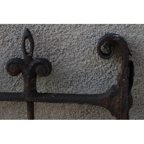 484 - A VICTORIAN CAST IRON GARDEN GATE of two tier barred form with fleur de lys finials and scroll heade... 