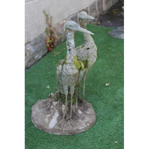 549 - A CAST IRON FOUNTAIN, modelled as a pair of herons amongst foliage issuing a water spout, on circula... 