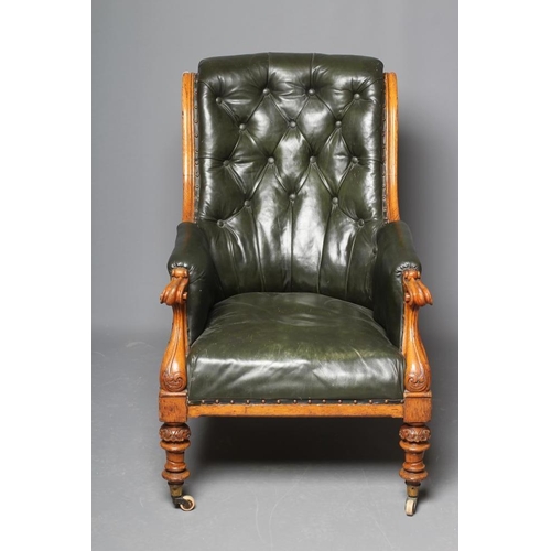 659 - AN MID VICTORIAN OAK FRAMED ARMCHAIR button upholstered in green leather, channelled scroll back upr... 