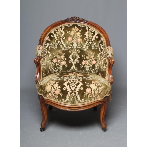 664 - A VICTORIAN WALNUT SHOW FRAME NURSING CHAIR button upholstered in green cut velvet, the arched back ... 