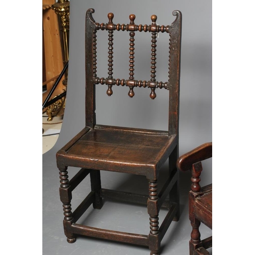 672 - A JOINED OAK ARMCHAIR, early 18th century, the twin panelled back with waved top rail, shaped downsw... 