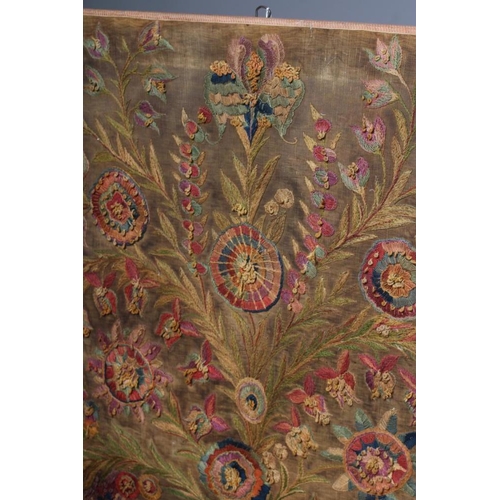 310 - AN ART NOUVEAU STITCHED PANEL worked in coloured wools in long stitch and with knotted loops with st... 