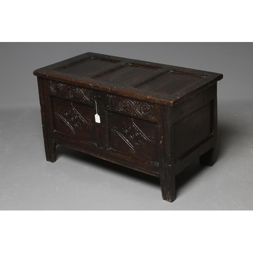 673 - A JOINED OAK PANELLED COFFER, early 18th century, the triple panel lid opening to interior with till... 