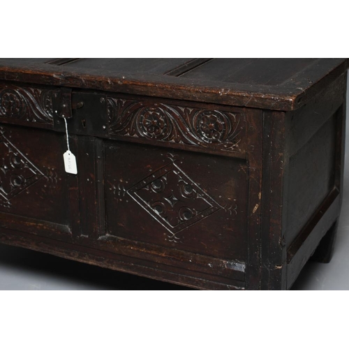 673 - A JOINED OAK PANELLED COFFER, early 18th century, the triple panel lid opening to interior with till... 