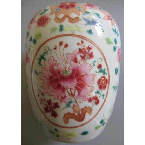 6 - A CHINESE PORCELAIN FAMILLE ROSE JAR of ovoid form painted with roundels of peonies on a scattered f... 