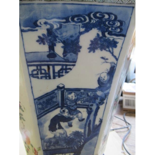 12 - A CHINESE PORCELAIN VASE of swept octagonal form with two scrolling handles, painted in in underglaz... 