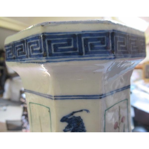 12 - A CHINESE PORCELAIN VASE of swept octagonal form with two scrolling handles, painted in in underglaz... 