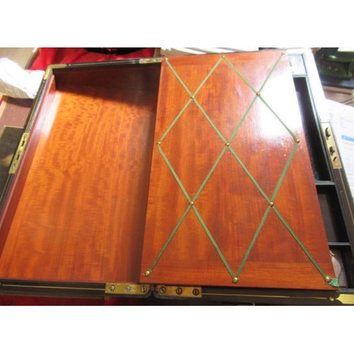 296 - A VICTORIAN MAHOGANY AND BRASS BOUND LAP DESK, the lid inset with brass shield inscribed 