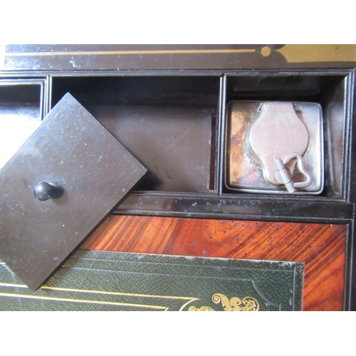 296 - A VICTORIAN MAHOGANY AND BRASS BOUND LAP DESK, the lid inset with brass shield inscribed 