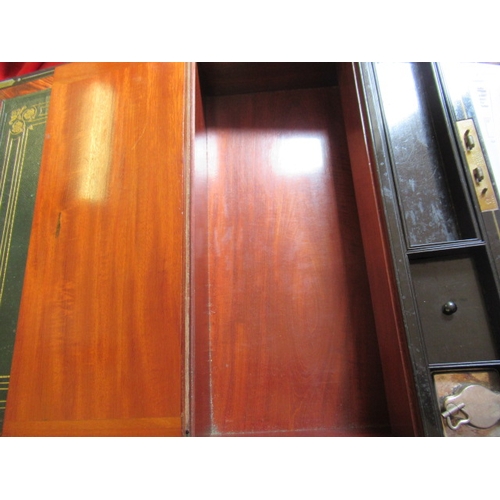 296 - A VICTORIAN MAHOGANY AND BRASS BOUND LAP DESK, the lid inset with brass shield inscribed 