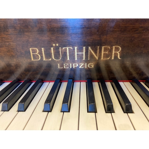 675 - A BLUTHNER BABY GRAND PIANO, in mahogany case with arched solid music stand, raised on square taperi... 