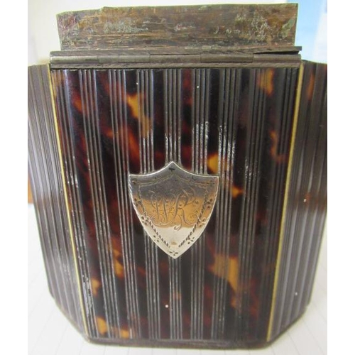 319 - A GEORGE III SMALL TORTOISESHELL TEA CADDY, c.1790, of canted oblong form, the press moulded ribbed ... 