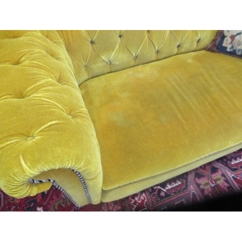 624 - A VICTORIAN WALNUT FRAMED CHESTERFIELD DROP END SETTEE button upholstered in mustard yellow velvet, ... 