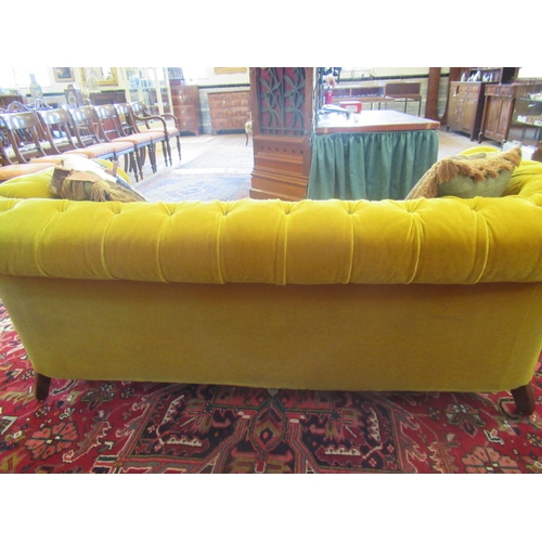 624 - A VICTORIAN WALNUT FRAMED CHESTERFIELD DROP END SETTEE button upholstered in mustard yellow velvet, ... 