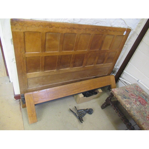 603 - A ROBERT THOMPSON ADZED OAK DOUBLE BEDSTEAD, the multi-panelled headboard with half penny moulded co... 