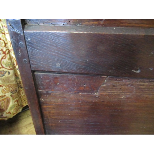 662 - AN OAK CLOTHES PRESS, c.1700, the moulded edged plank top over a pair of twin panel doors enclosing ... 