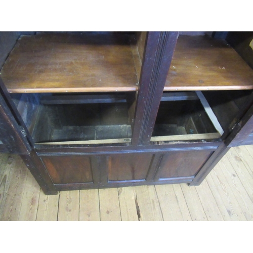 662 - AN OAK CLOTHES PRESS, c.1700, the moulded edged plank top over a pair of twin panel doors enclosing ... 