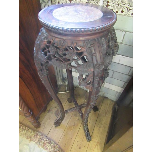 641 - A CHINESE HARDWOOD JARDINIERE STAND, c.1900, the beaded edge circular top with veined red marble ins... 