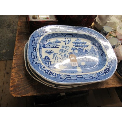 86 - FOUR WILLOW PATTERN BLUE AND WHITE MEAT PLATES