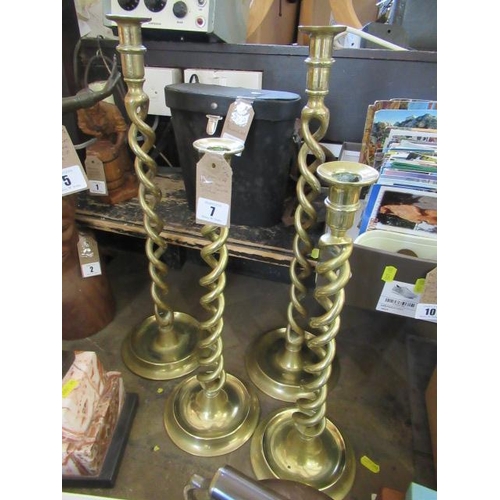 TWO PAIRS OF BRASS TWIST CANDLESTICKS