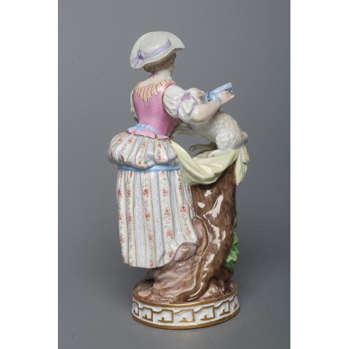 26 - A MEISSEN PORCELAIN FIGURE, late 19th century, modelled as a shepherdess wearing a blue hat, lace ch... 