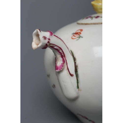 27 - A HOCHST PORCELAIN TEAPOT AND COVER, c.1760, of globular form with scroll handle and mask spout, pai... 