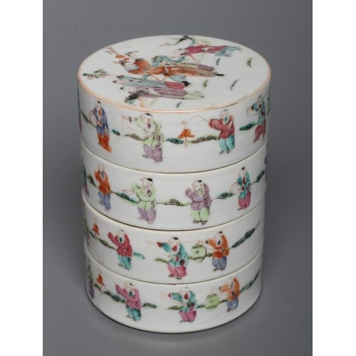 3 - A CHINESE PORCELAIN CYLINDRICAL THREE TIER STACKING BOX AND COVER painted in pastel enamels with fig... 