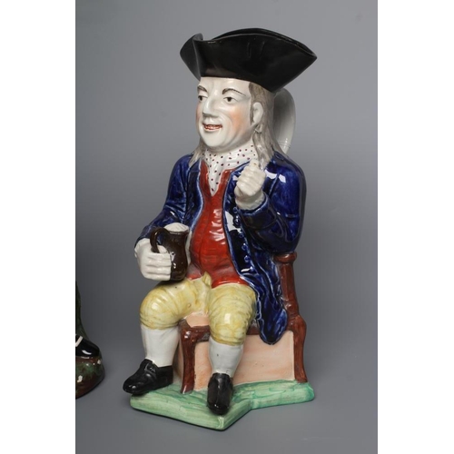 36 - A STAFFORDSHIRE POTTERY SQUIRE TOBY JUG, early 20th century, wearing a black tricorn hat, underglaze... 