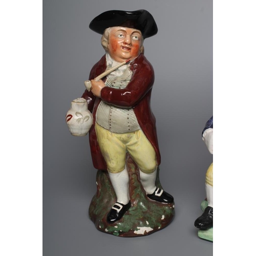 36 - A STAFFORDSHIRE POTTERY SQUIRE TOBY JUG, early 20th century, wearing a black tricorn hat, underglaze... 