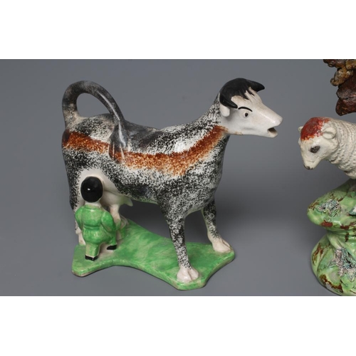 37 - A PAIR OF WALTON EARTHENWARE SPILL VASES, early 19th century, modelled as a ram and ewe both standin... 