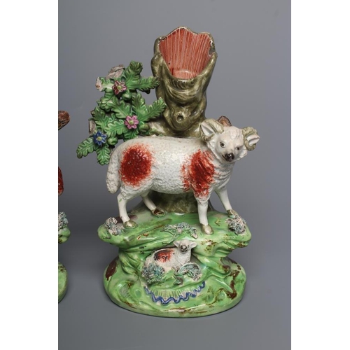 37 - A PAIR OF WALTON EARTHENWARE SPILL VASES, early 19th century, modelled as a ram and ewe both standin... 