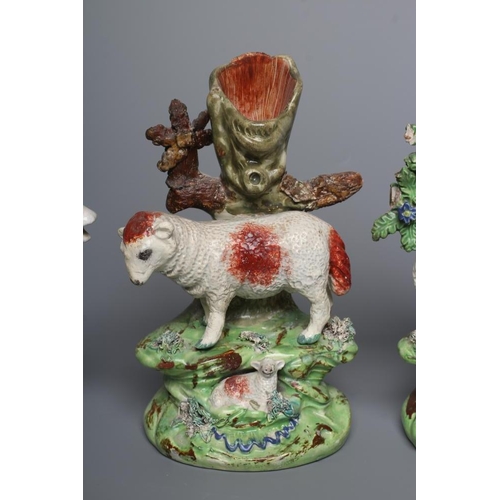 37 - A PAIR OF WALTON EARTHENWARE SPILL VASES, early 19th century, modelled as a ram and ewe both standin... 