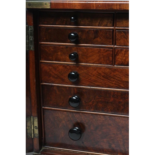 377 - A VICTORIAN WALNUT SPECIMEN TABLE CABINET of oblong form with brass campaign carrying handle and cor... 