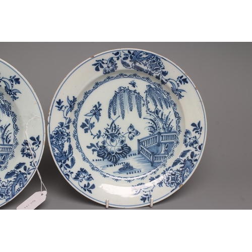 38 - A PAIR OF ENGLISH DELFT PLATES, probably Liverpool c.1760, painted in blue with a fence, weeping wil... 