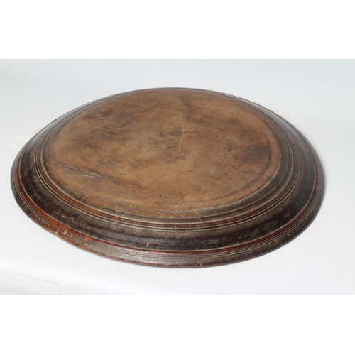 382 - A LARGE TURNED WOOD PLATTER of circular form, 23